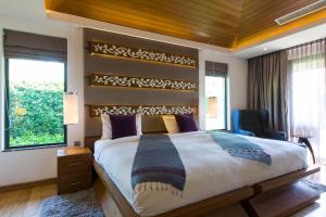 Postel nebo postele na pokoji v ubytování Dasiri Lakefront Villa + 35 fotografií