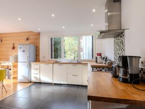 a kitchen with white appliances and wooden floors at Appartement Morzine, 4 pièces, 6 personnes - FR-1-754-23 in Morzine