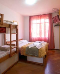Postel nebo postele na pokoji v ubytování Jardim Botânico House