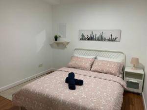 Menara Arina Uniti tesisinde bir odada yatak veya yataklar
