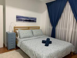 Un pat sau paturi într-o cameră la Menara Arina Uniti