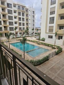 a view of a swimming pool from the balcony of a apartment at Airport Break in Nouaceur