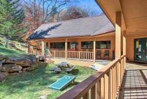 a house with a picnic table in the yard at Cedar Village Condominiums in Beech Mountain