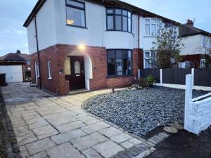 a large white house with a driveway at Clifton House, For Holidays, Contractors, Relocation, Work, Etc, Free Parking and Wifi in Preston