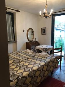 En eller flere senge i et værelse på appartamenti vacanza El Remanso