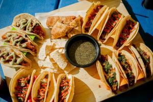 a plate of sandwiches and chips and a bowl of dips at Little Mod in Charlottesville