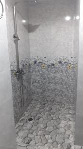 a shower with a glass door in a bathroom at BAKURIANI MIX in Bakuriani