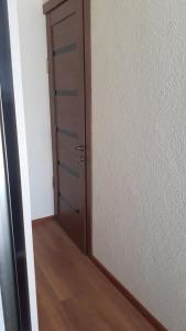an empty room with a door and a wooden floor at BAKURIANI MIX in Bakuriani