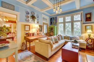 a living room with a couch and a table at Private Pool and Backyard Lavish New Orleans Haven! in New Orleans