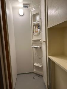 a refrigerator with its door open in a room at Guest House Tosa Otesujihana Dormitory women only- Vacation STAY 14354 in Kochi