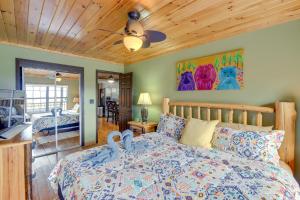 a bedroom with a bed with a wooden ceiling at Above and Beyond Pigeon Forge Cabin with Prime Views! in Pigeon Forge