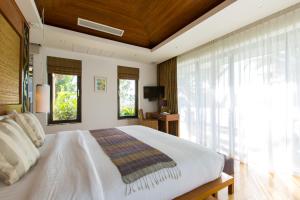 Postel nebo postele na pokoji v ubytování Dasiri Lakefront Villa