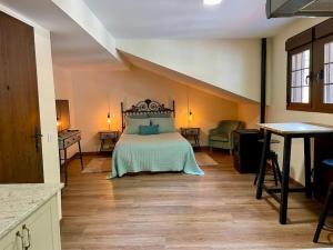 a large bedroom with a bed in a room at Casina Marqués in Cudillero
