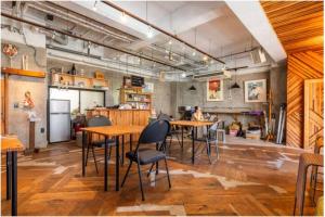 a restaurant with tables and chairs in a room at Little Okawood - Vacation STAY 83117v in Ōkawa