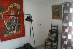 a room with a lamp and a painting on the wall at Bright house with garden - île de Ré in Saint-Clément-des-Baleines