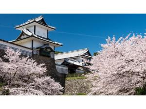 an osaka castle withakura trees in front of it at Yamashiro Onsen Yuzankaku - Vacation STAY 86432v in Kaga