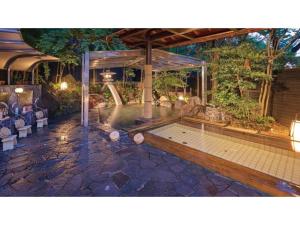 a swimming pool in the middle of a patio at Yamashiro Onsen Yuzankaku - Vacation STAY 86433v in Kaga +52 photos