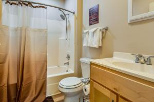 a bathroom with a toilet and a sink and a shower at Tuskegee Countryside Retreat on 7 Acres! in Tuskegee +20 photos