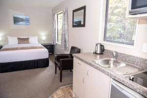 Rúm í herbergi á 58 On Cron Motel