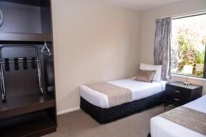 Rúm í herbergi á 58 On Cron Motel