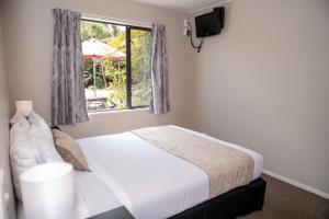 Rúm í herbergi á 58 On Cron Motel