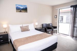 Rúm í herbergi á 58 On Cron Motel