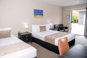 Rúm í herbergi á 58 On Cron Motel