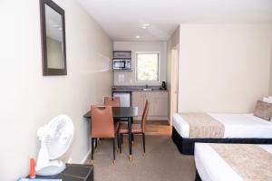 Rúm í herbergi á 58 On Cron Motel
