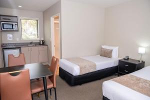 Rúm í herbergi á 58 On Cron Motel