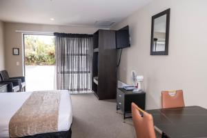 Rúm í herbergi á 58 On Cron Motel
