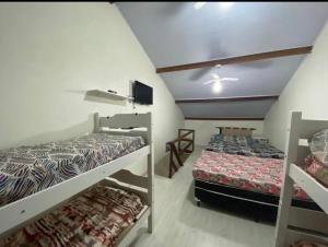 Ένα ή περισσότερα κρεβάτια σε δωμάτιο στο Condomínio Lazer completo Familiar