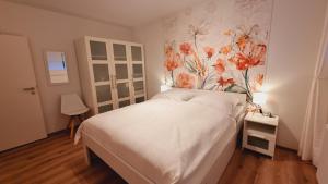 Katil atau katil-katil dalam bilik di Ferienwohnung Mohnwiese und Blumenwiese