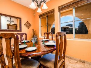 a dining room with a wooden table and chairs at Beautiful San Felipe Getaway in La Ponderosa +26 photos