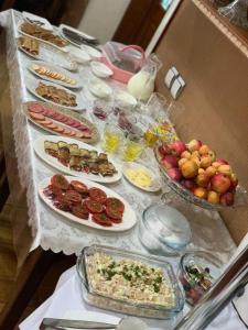 a table with many plates of food on it at ALMOS in Dushanbe