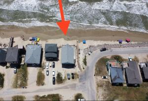 an aerial view of a house next to the ocean at Surfside Beachfront Dream in Surfside Beach