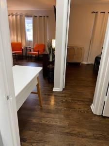 a hallway of a living room with a table at Modern & Cozy 2 bedroom home near downtown Shawnee in Shawnee