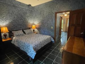 a bedroom with a bed and two lamps in it at Belize Budget Suites in San Pedro +88 photos