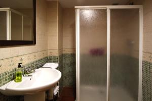 a bathroom with a sink and a shower at Casa 1340 in Mora de Rubielos