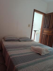 Een bed of bedden in een kamer bij Hotel Pousada Stephanne