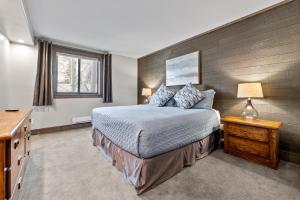 a bedroom with a bed and a table with a lamp at Corinthian Circle - Dillon in Dillon +33 photos