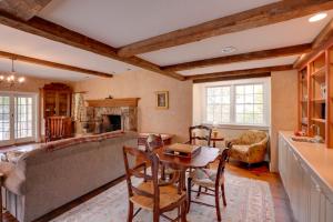 a living room with a table and a couch at Historic New Lebanon Hideaway on 33 Private Acres! in New Lebanon