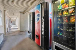 a room filled with vending machines and soda cans at Motel 6 Tucson, AZ - East Williams Center in Tucson