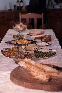 a table with many different types of food on it at Bahan Pousada - Pousada em Ubatuba in Ubatuba