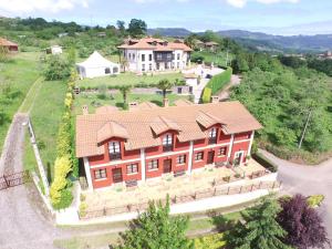 an aerial view of a large house with a roof at El Molín de Petra in Valbucar