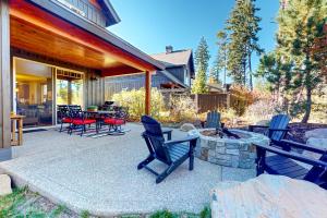 a patio with chairs and a table and a fire pit at Sweet Sunshine in Cle Elum