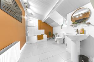 a white bathroom with a sink and a toilet at 8 Corkickle in Whitehaven +65 photos