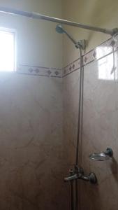 a shower in a bathroom with a glass door at Afecto in San Gregorio de Polanco