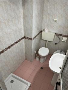 a bathroom with a toilet and a sink at ~Villa Gloria~ in Durrës