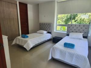 מיטה או מיטות בחדר ב-Casa Campo Villa Ofir