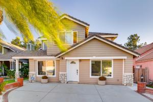 a house with a palm tree in front of it at Fast WiFi and Free Parking Cozy Fontana Apartment in Fontana